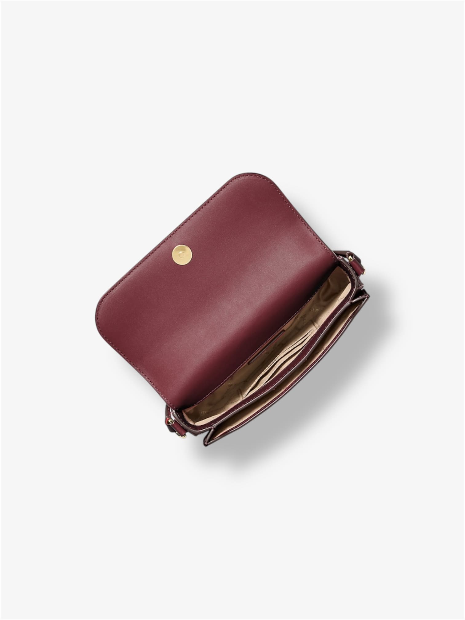 Innenansicht der Michael Kors Umhaengetasche in Oxblood - zwei Hauptfaecher und Kartenfaecher sichtbar